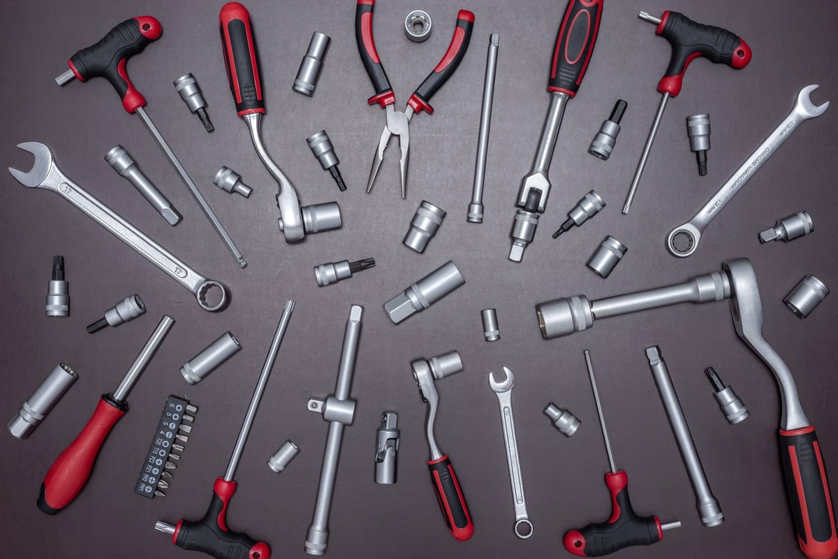 Set of various auto mechanic tools on a working table